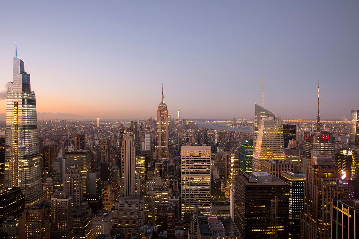 Sunlight hitting the skyscrapers of Manhattan at sunset.