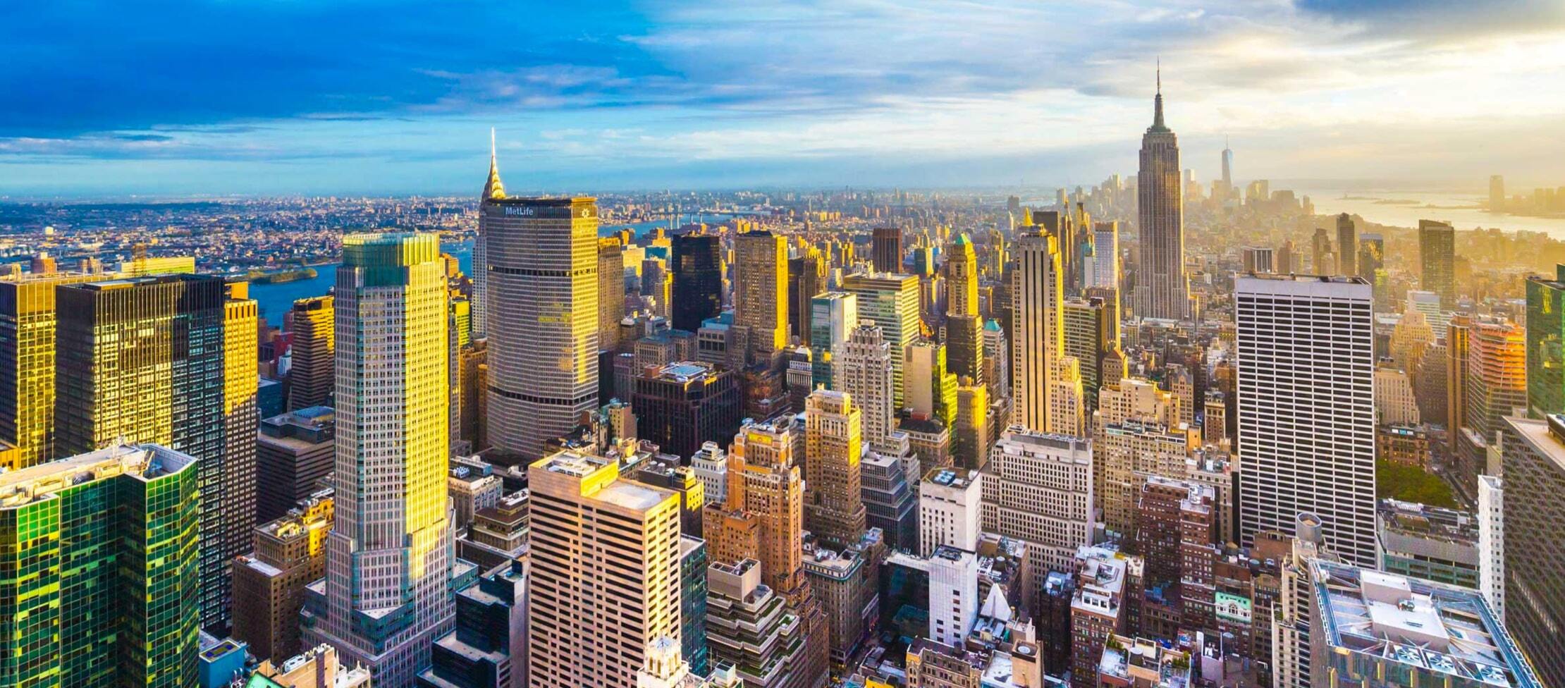 Sunlight hitting the skyscrapers of Manhattan at sunset.